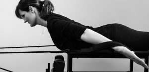 Back strengthening exercises on a reformer bed