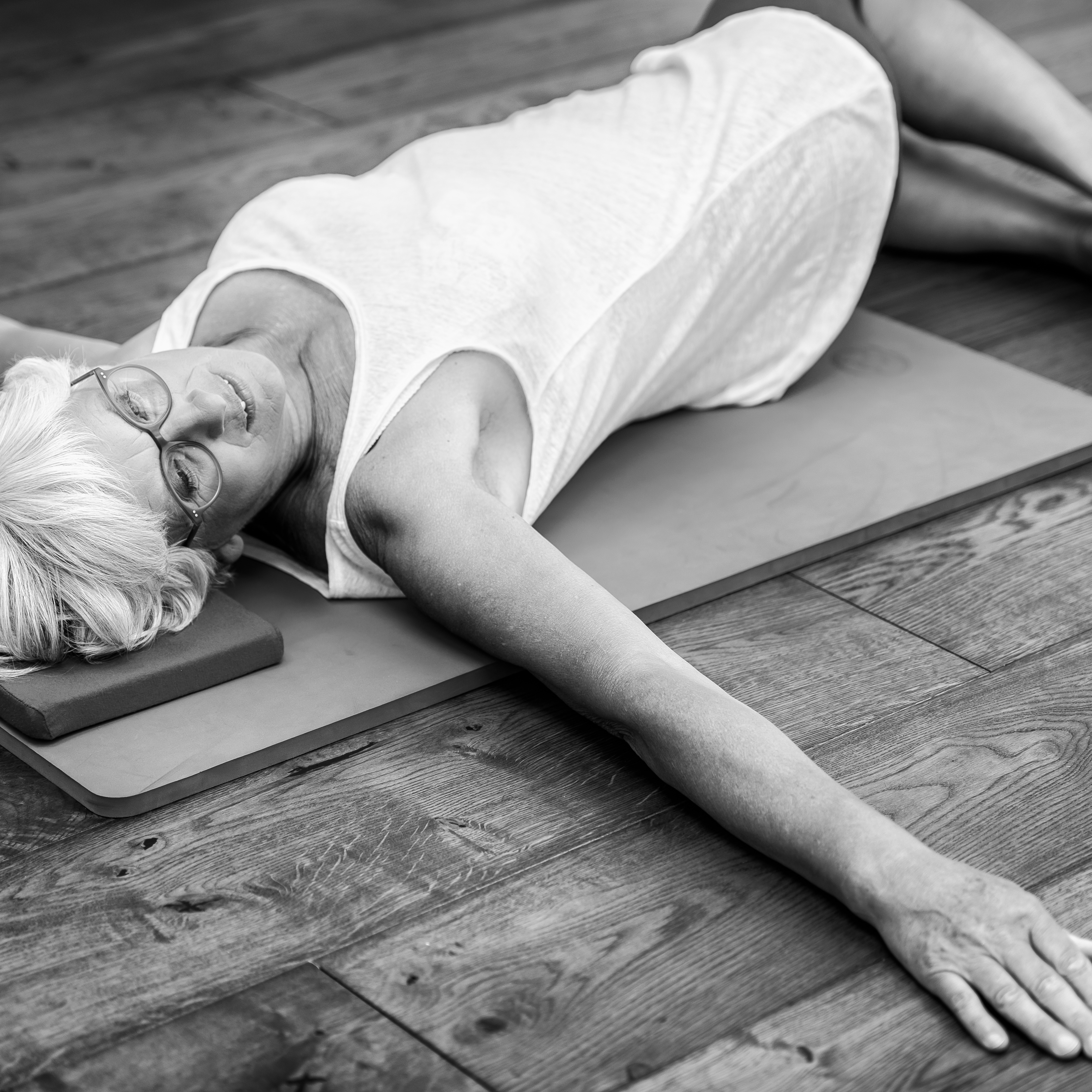 older lady, menopause, pilates black and white photo